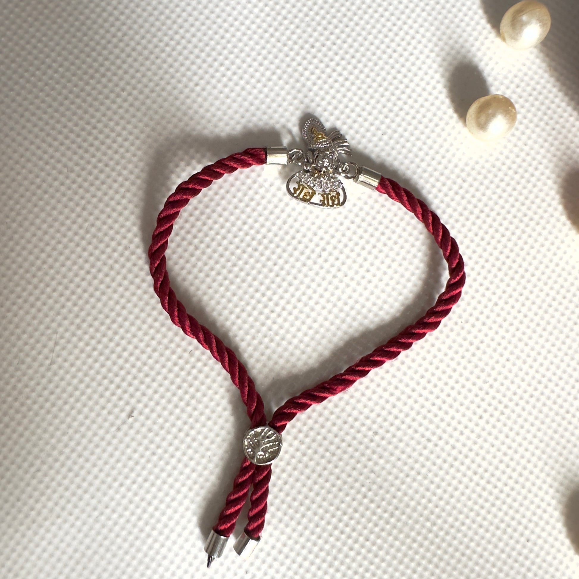 Radhe Radhe Krishna Face Rakhi – 92.5 Silver Finish with Adjustable Maroon Thread