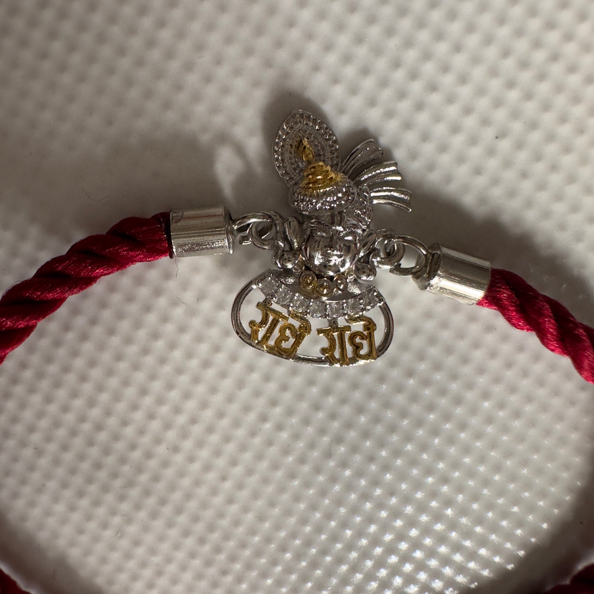 Radhe Radhe Krishna Face Rakhi – 92.5 Silver Finish with Adjustable Maroon Thread
