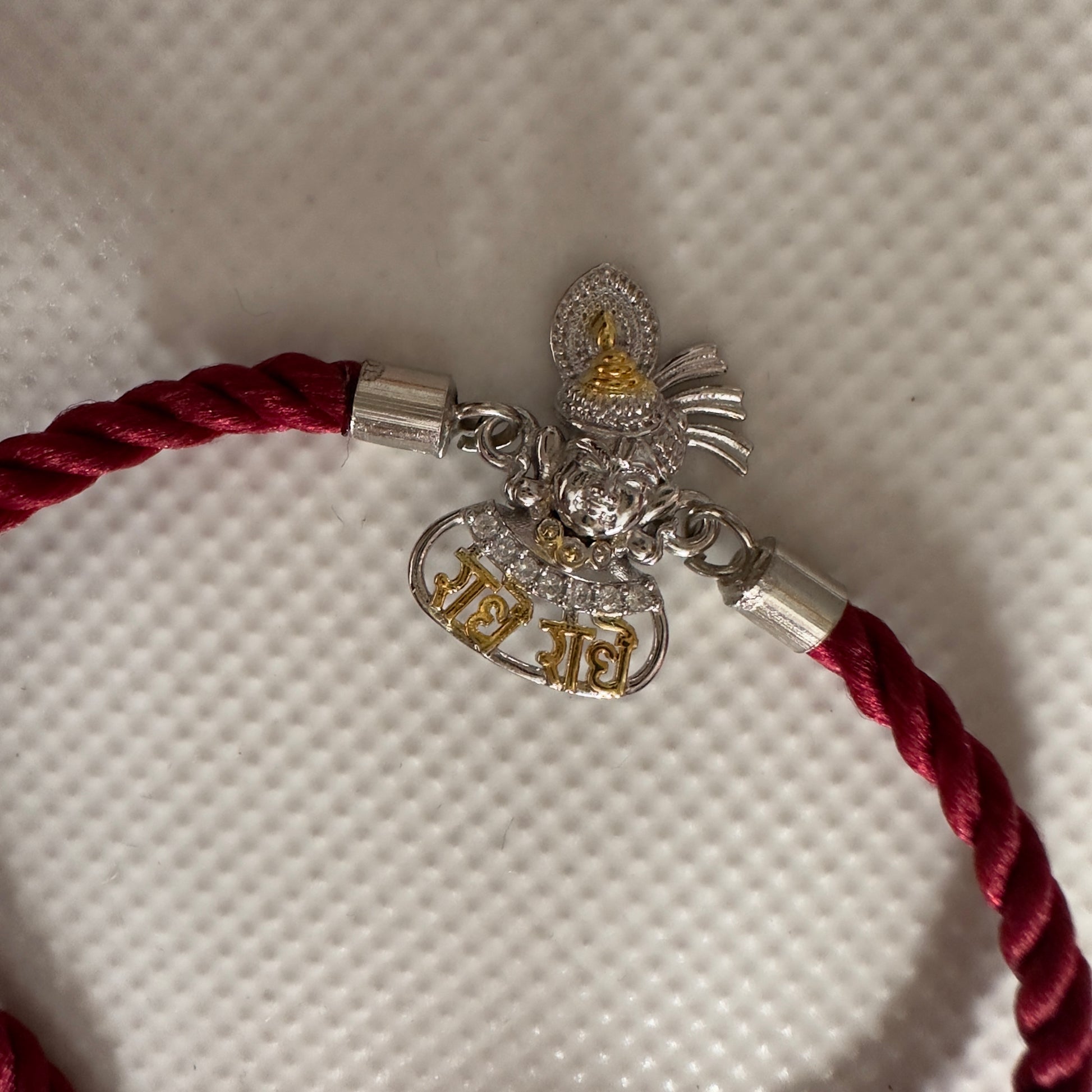 Radhe Radhe Krishna Face Rakhi – 92.5 Silver Finish with Adjustable Maroon Thread