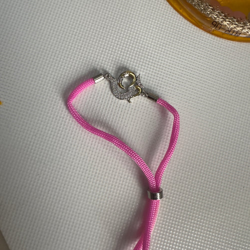 93.5 Silver Om Rakhi – Pink Thread Edition