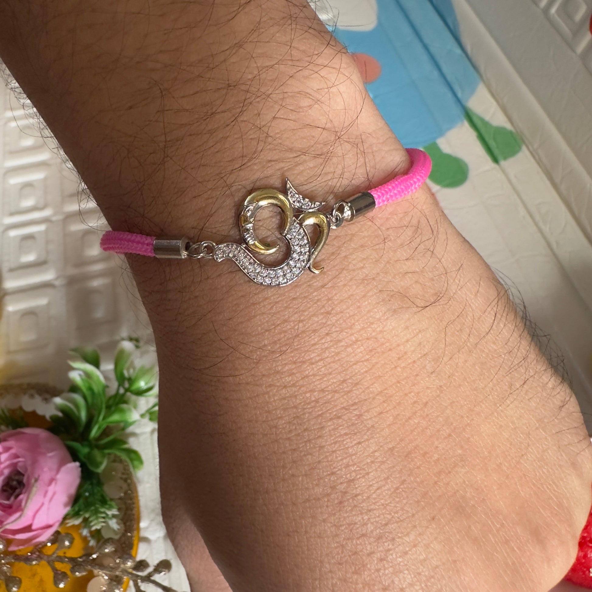 93.5 Silver Om Rakhi – Pink Thread Edition