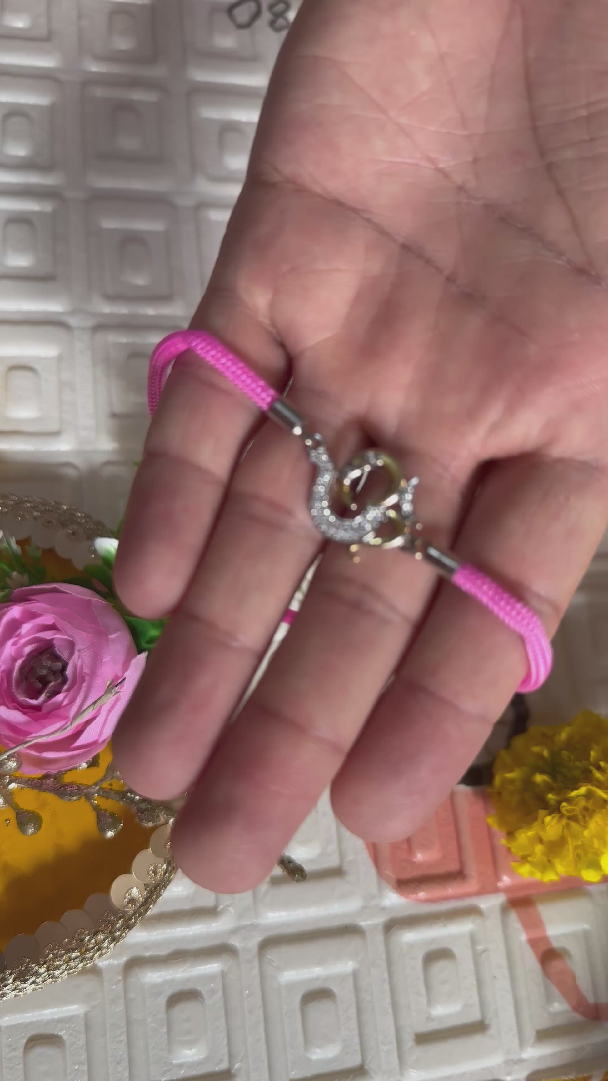 93.5 Silver Om Rakhi – Pink Thread Edition