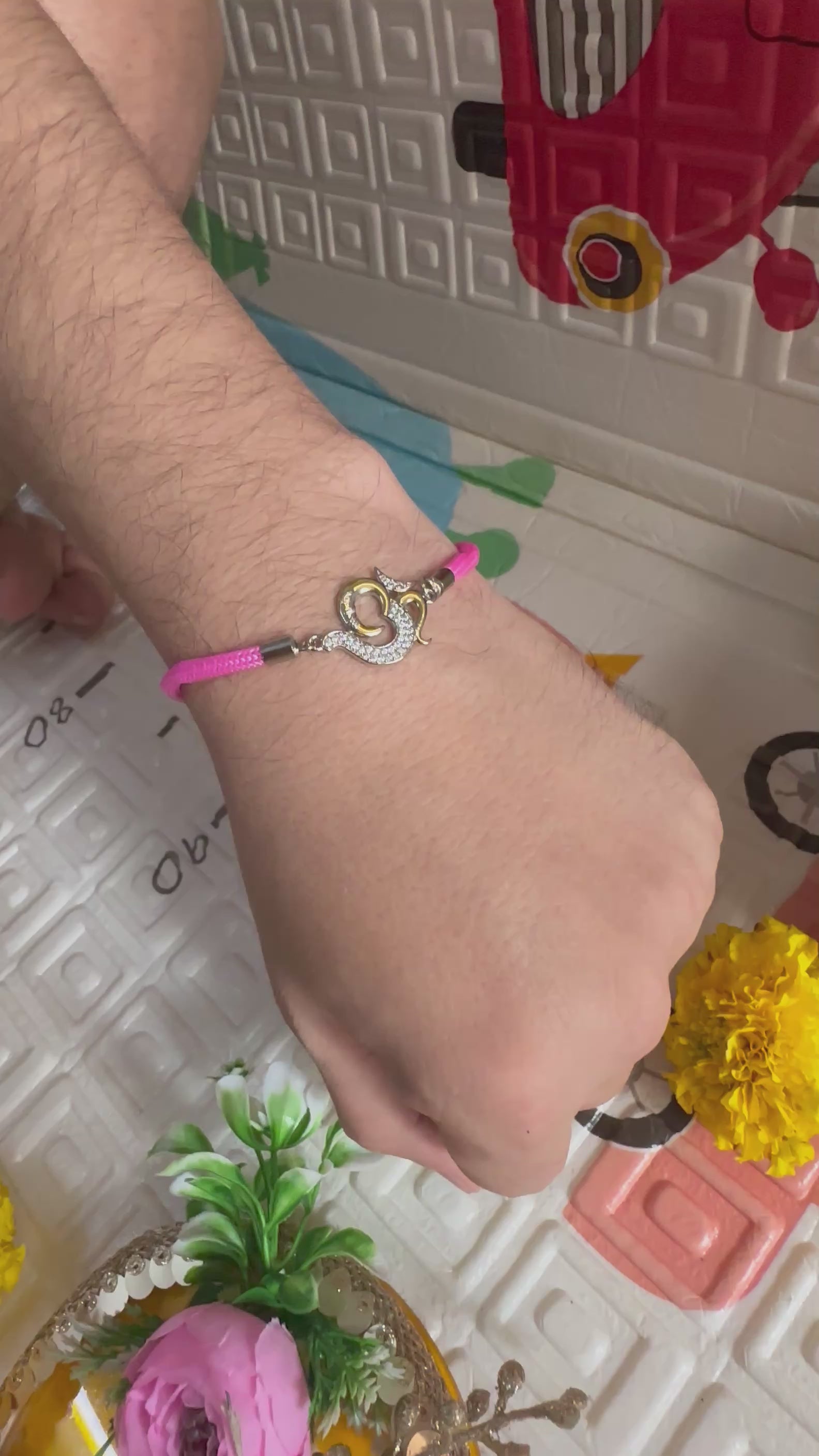 93.5 Silver Om Rakhi – Pink Thread Edition